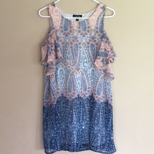 Mid-length dress with off the shoulder parts.